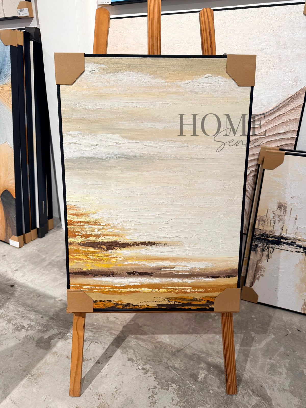 Angled view of Golden Stillness textured acrylic wall art with a warm golden shoreline and neutral sky
