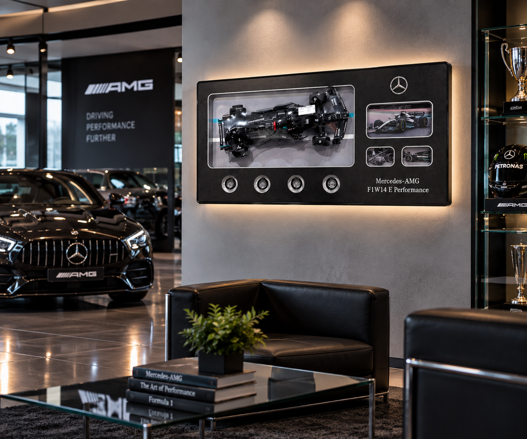 Black Formula-style racing-car model display in a black aluminium frame