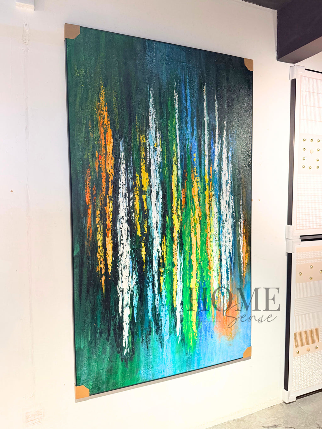 Emerald Rain oversized vertical abstract painting displayed on a feature wall